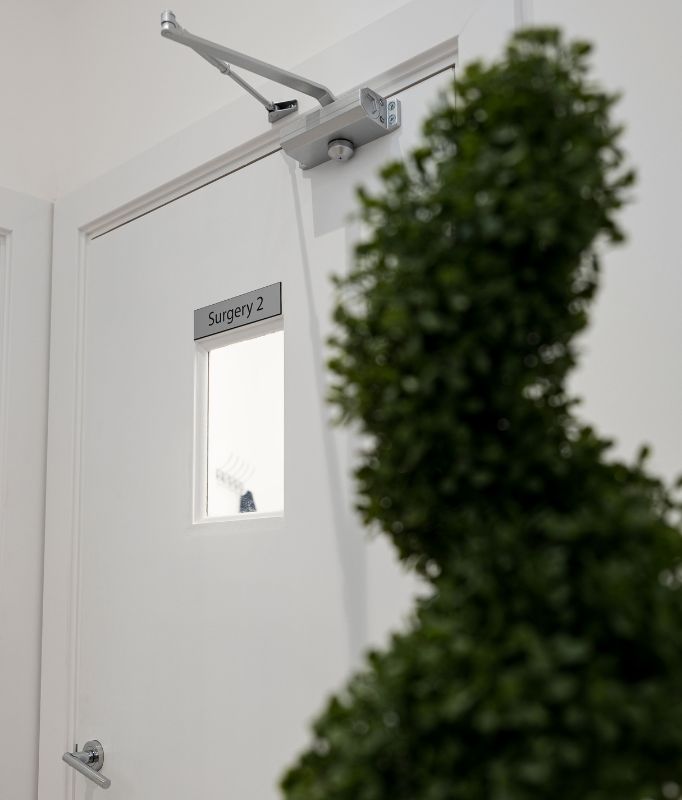 Photo of an interior plant and treatment door at Shape Dental