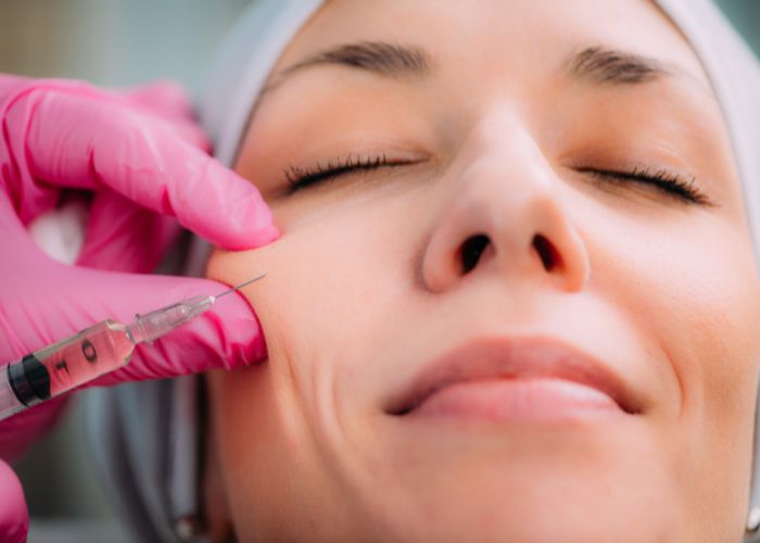 Close up photo of a woman receiving a cosmetic facial injection